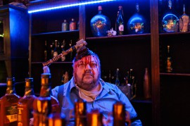 Gert Thumser plays the bartender in the Bar of the Afterlife.//Photography by Katja Oortman